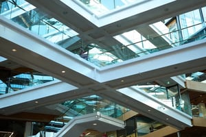 View from floor looking up at staircase with glass